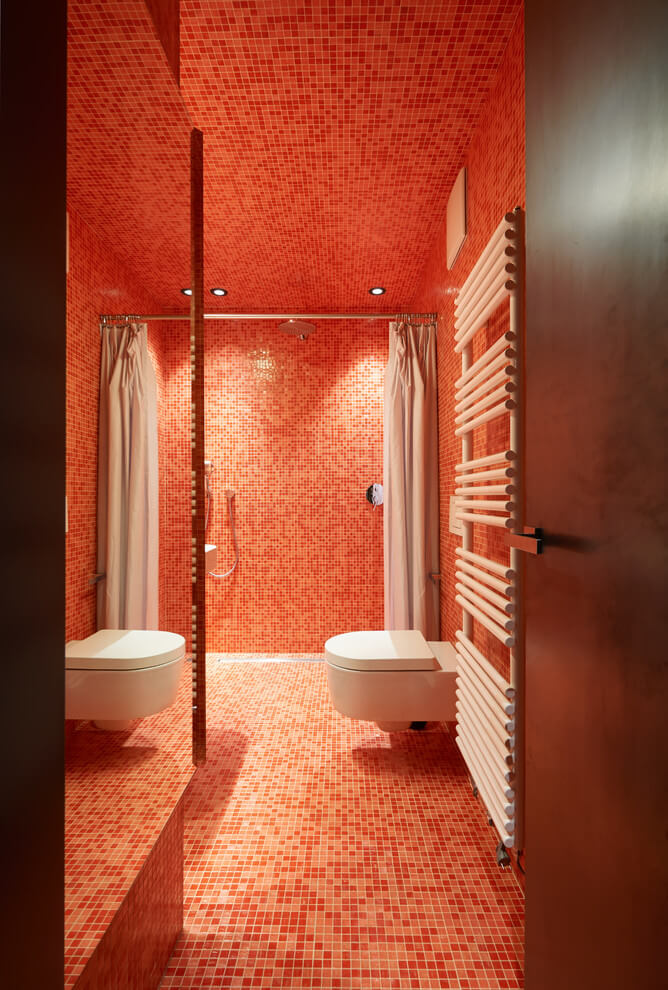 Fully Tiled Red Bathroom Design